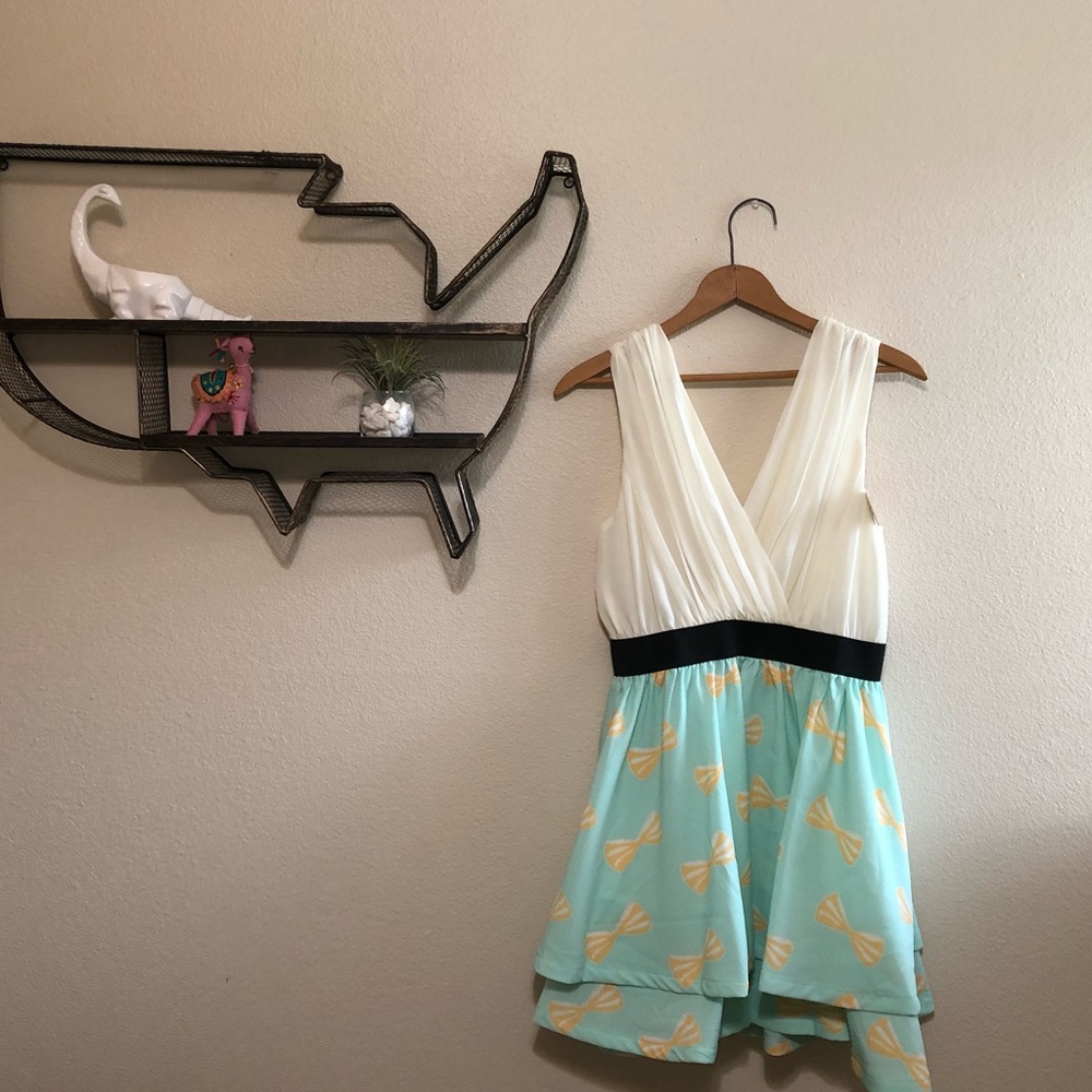 Low cut teal and cream bow pattern boutique dress